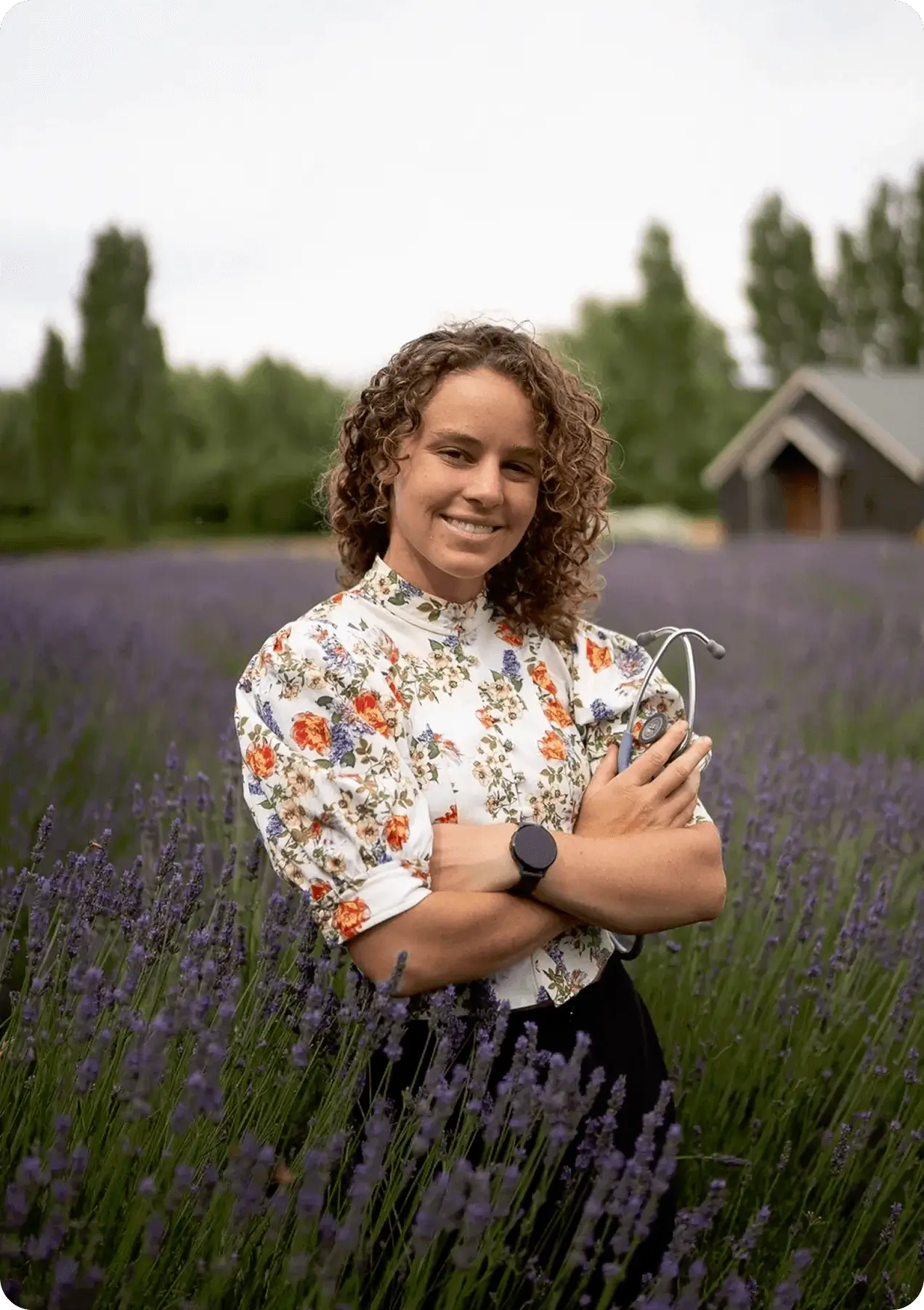 A woman standing in a field of flowers